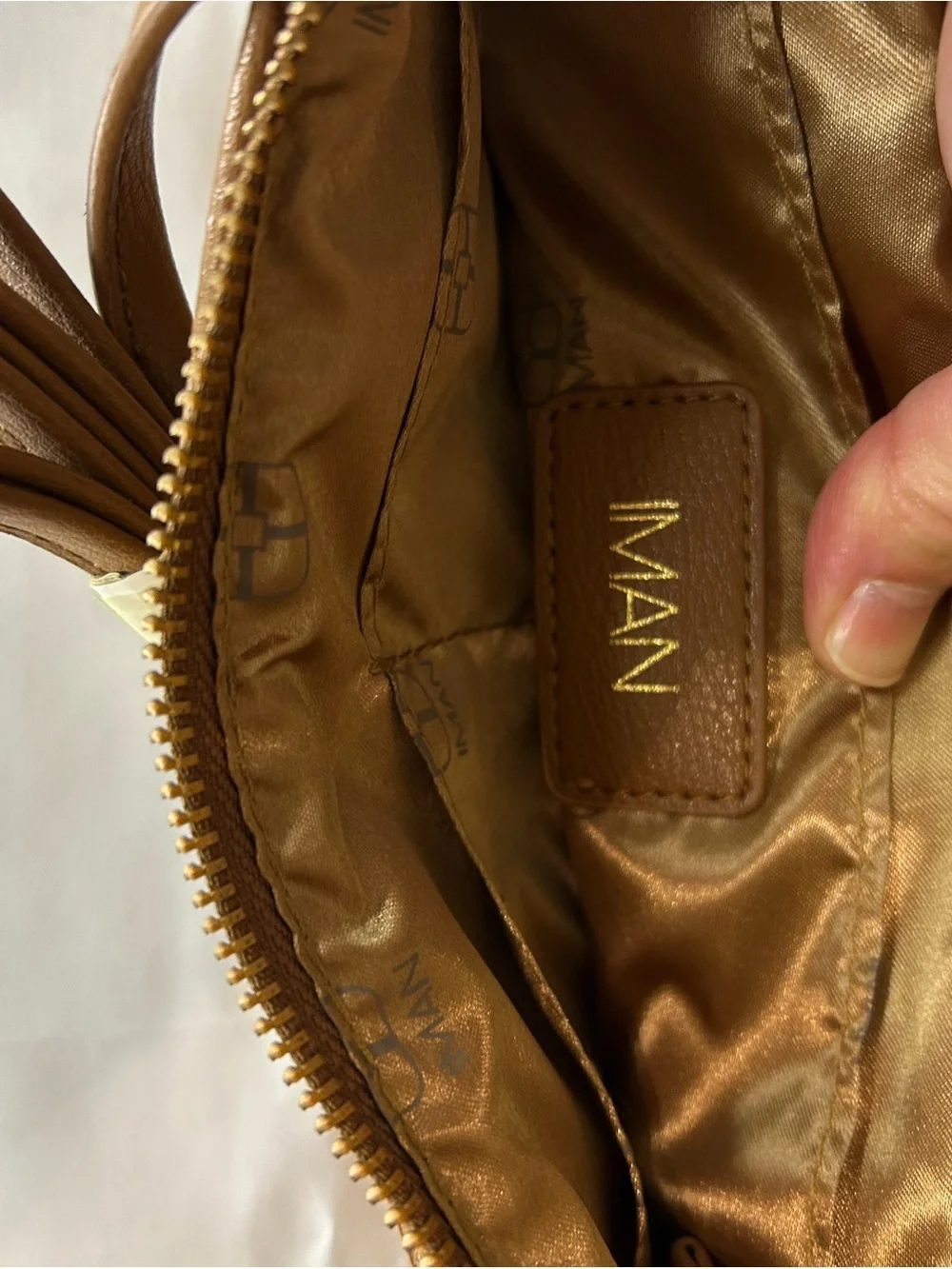 IMAN Quilted Tan Crossbody with Gold Medallion